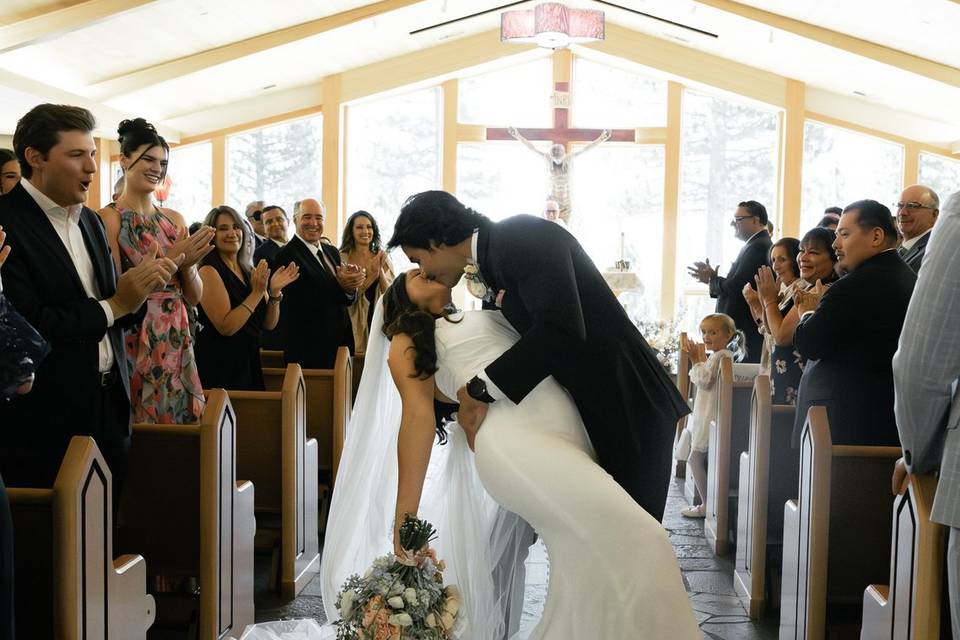 Bride groom church kiss