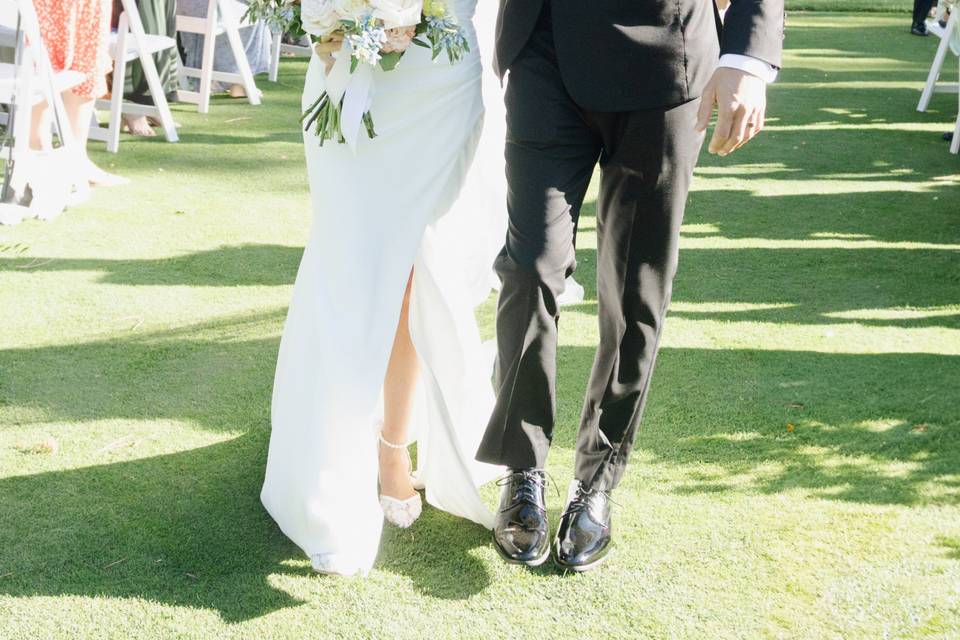 Bride groom walking down aisle