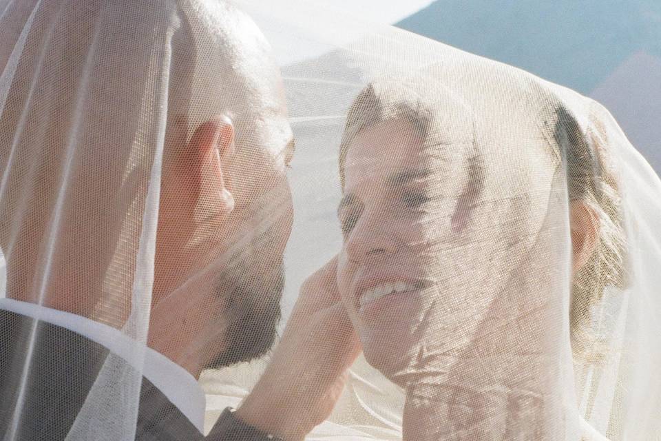 Bride groom under veil