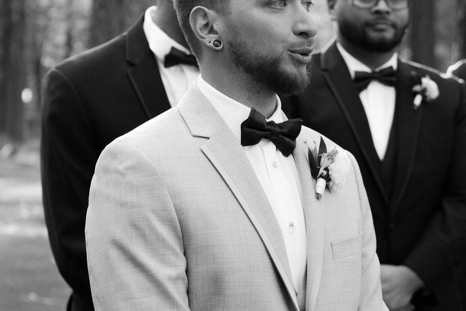 Close up groom end of aisle