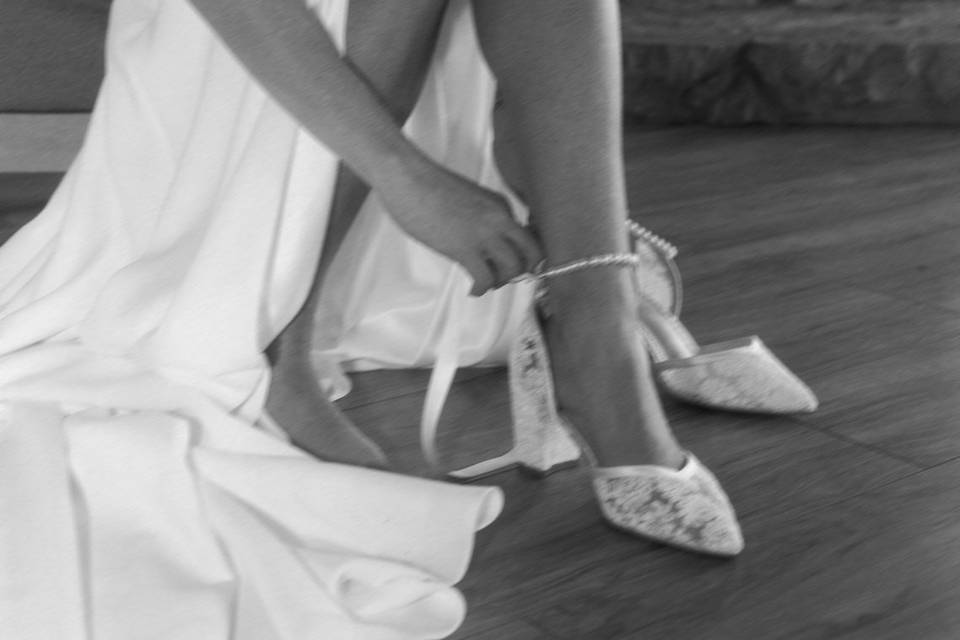 Bride putting on shoes