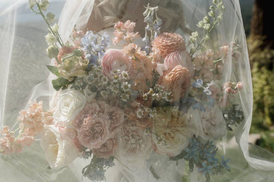 Bridal bouquet under veil