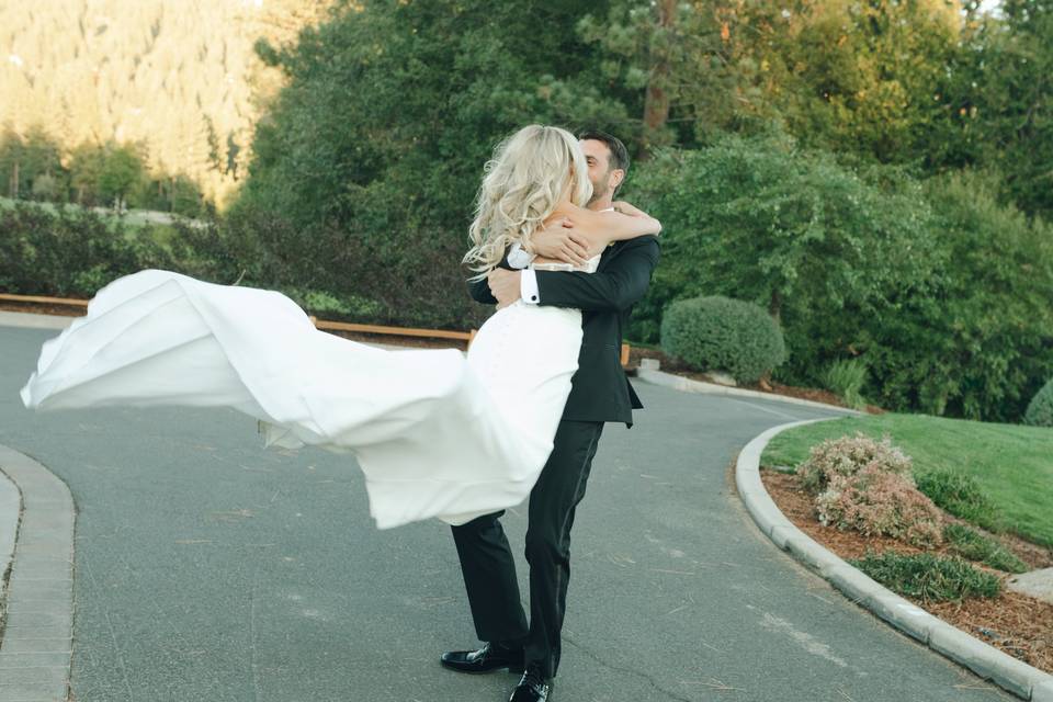 Groom spinning bride