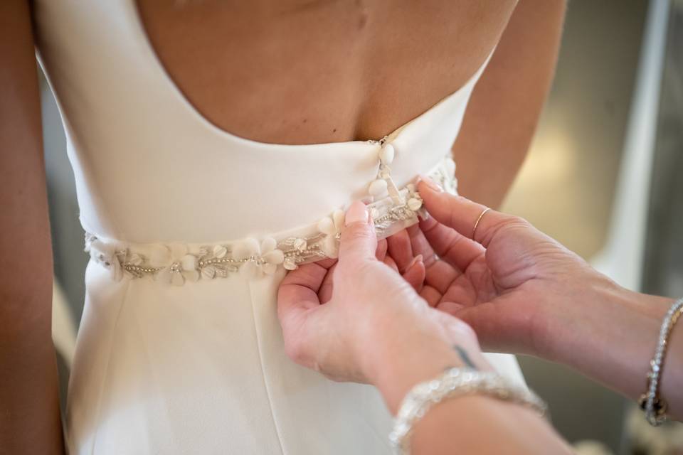 Zipping up the dress