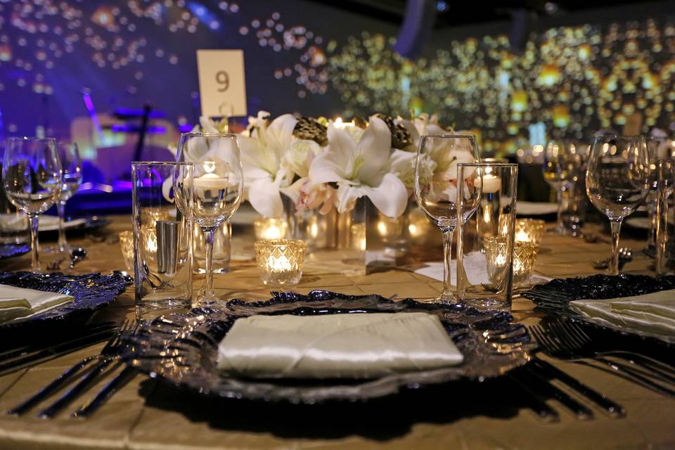 Table setting with floral and candle centerpiece