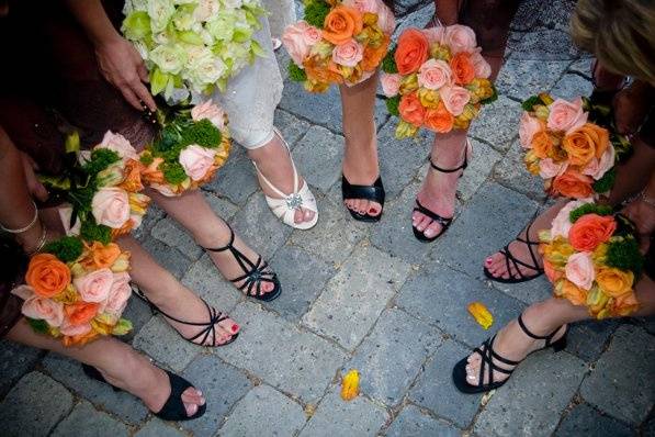 Bride and her bridesmaid holding bouquet