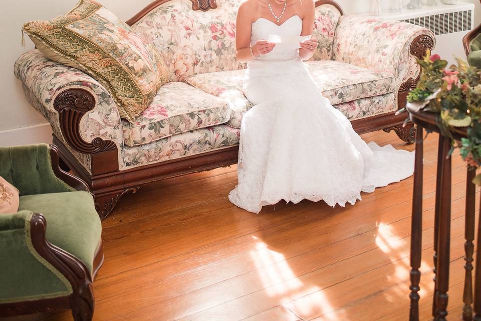Bride reading by the window