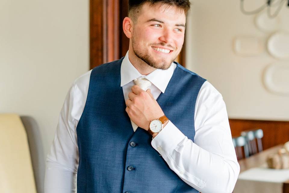 Groom inside farmhouse