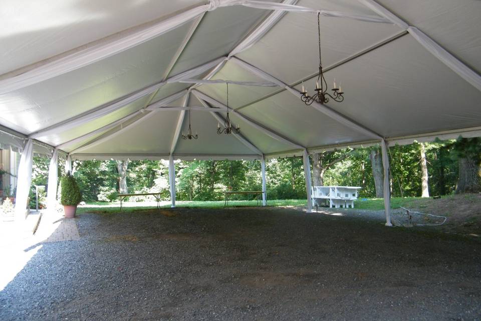 NAVI-TRAC TENT w/fabic swags and pole skirts in the 30ft wide series x 60ft long. This tenting is great for tight areas and areas exposed to high winds. Window walls in tracks available to enclose tenting