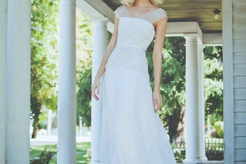 Style: 11009HYACINTH Full length gown of silk voile with striped elastic trim throughout bodice. Silk sash at waist with bow at center back. Available in white only. 100% silk.