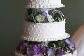 Layered cake with purple flowers