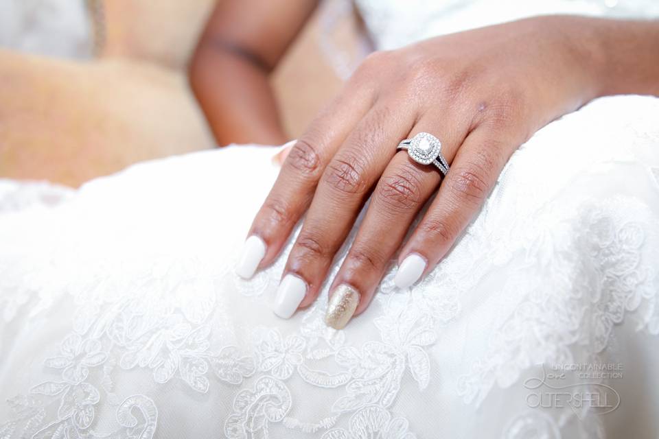 The ring against the lacy dress
