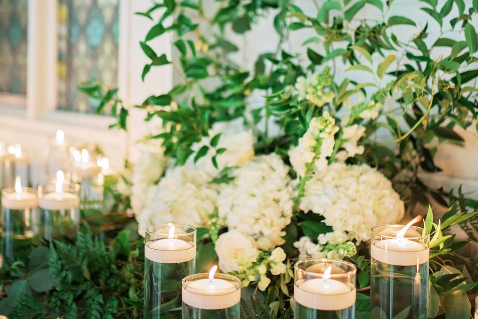 Greenery, flowers, and candles