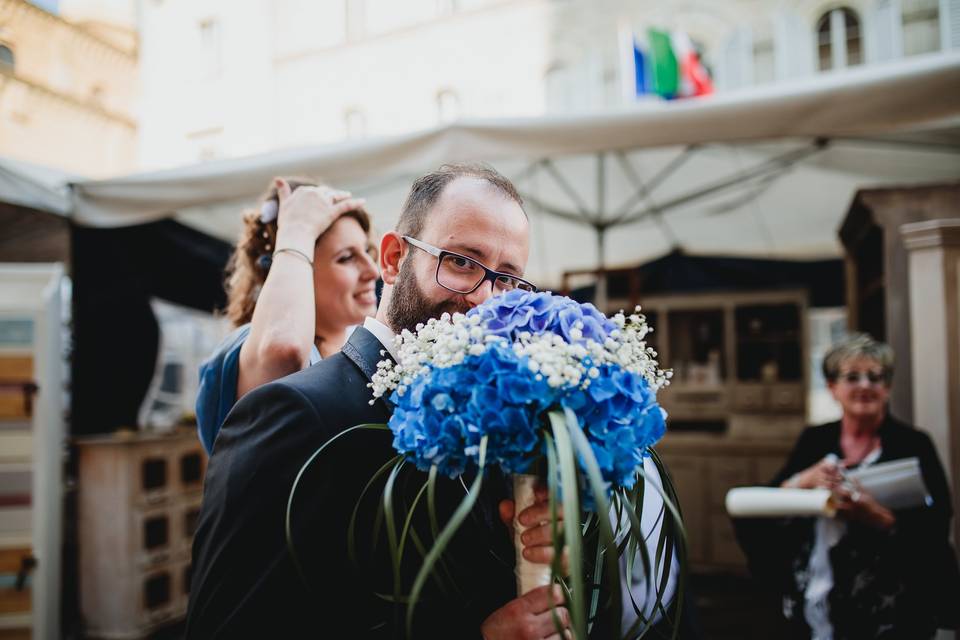 A groom and a bouquet