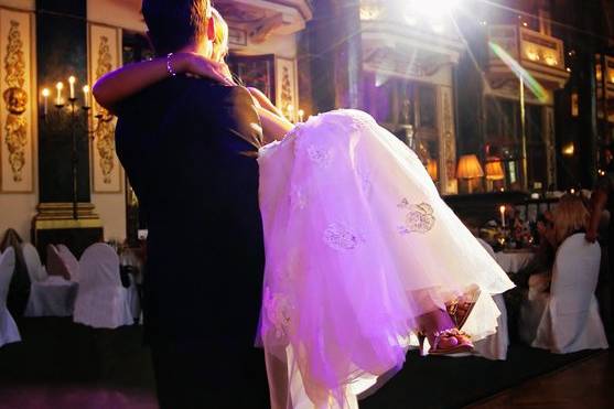 Groom carrying his bride