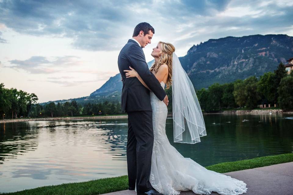 Bride and groom by the lake