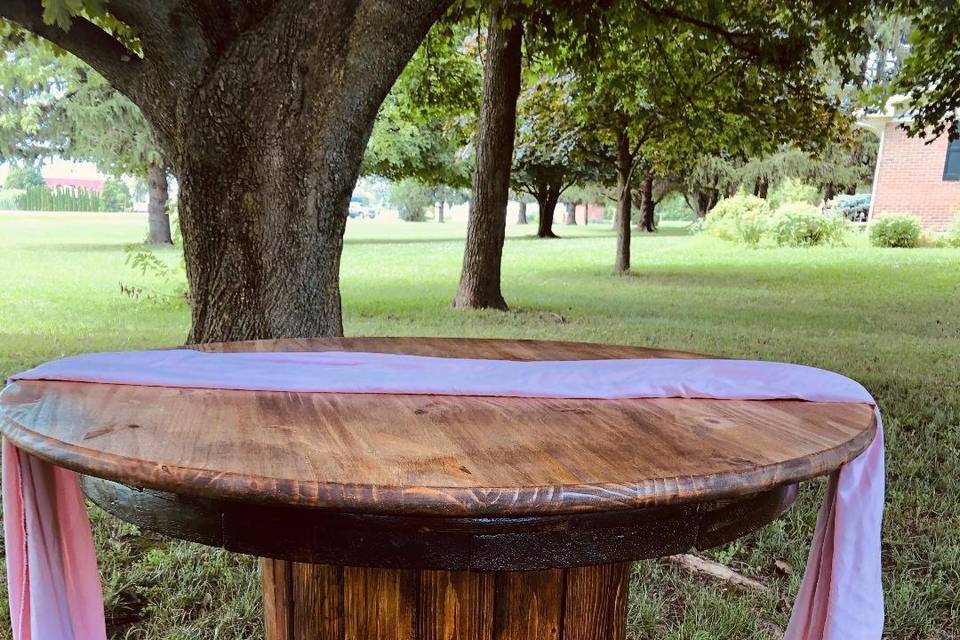 Round wood cake table