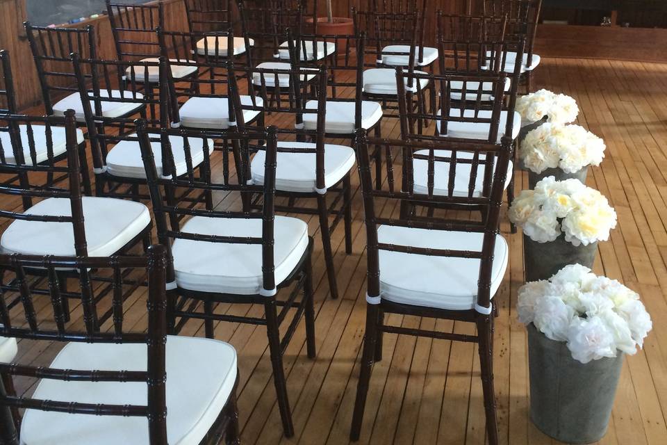 Indoor ceremony with original chalkboards and teacher cabinet.