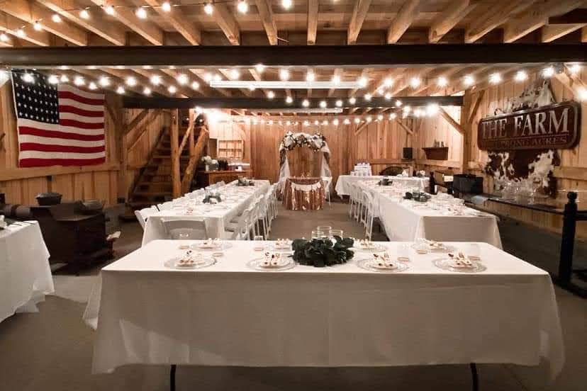 Tables set up inside barn