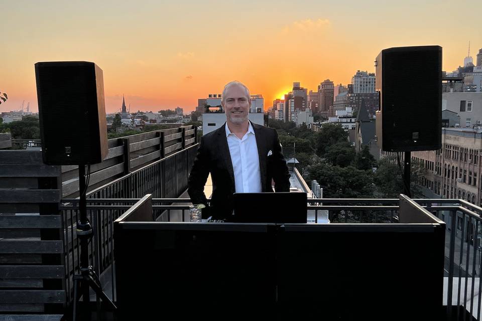 Rooftop DJ booth at sunset