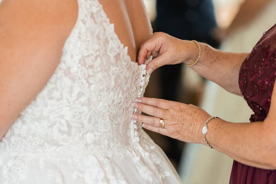 Mom zipping up the dress