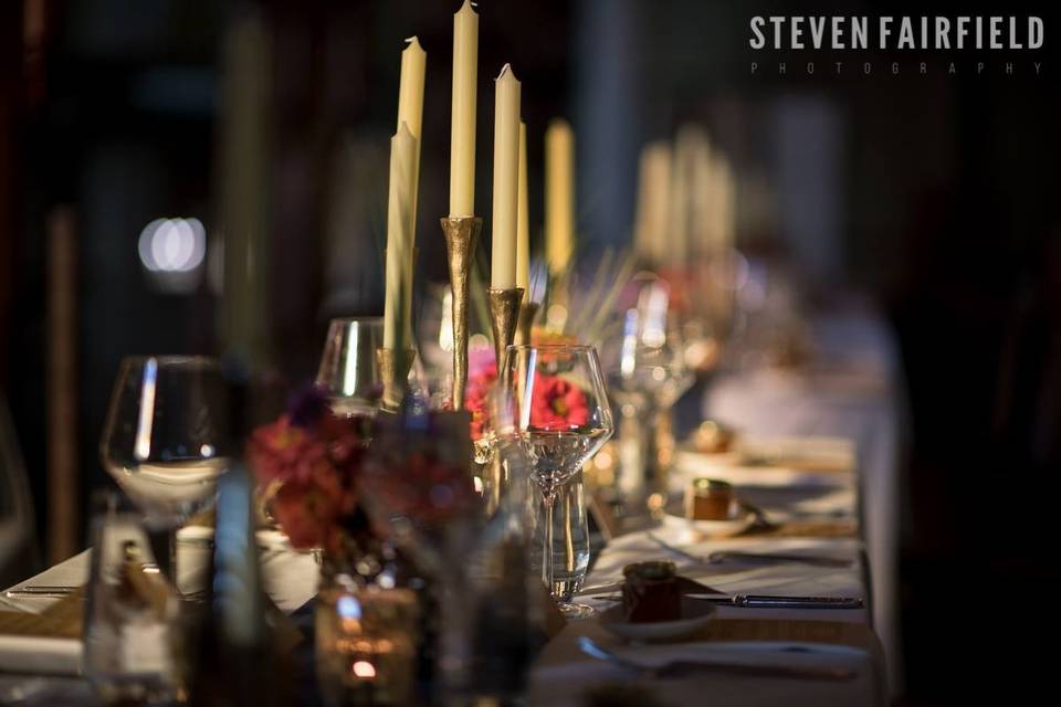 Table setting with candle centerpiece