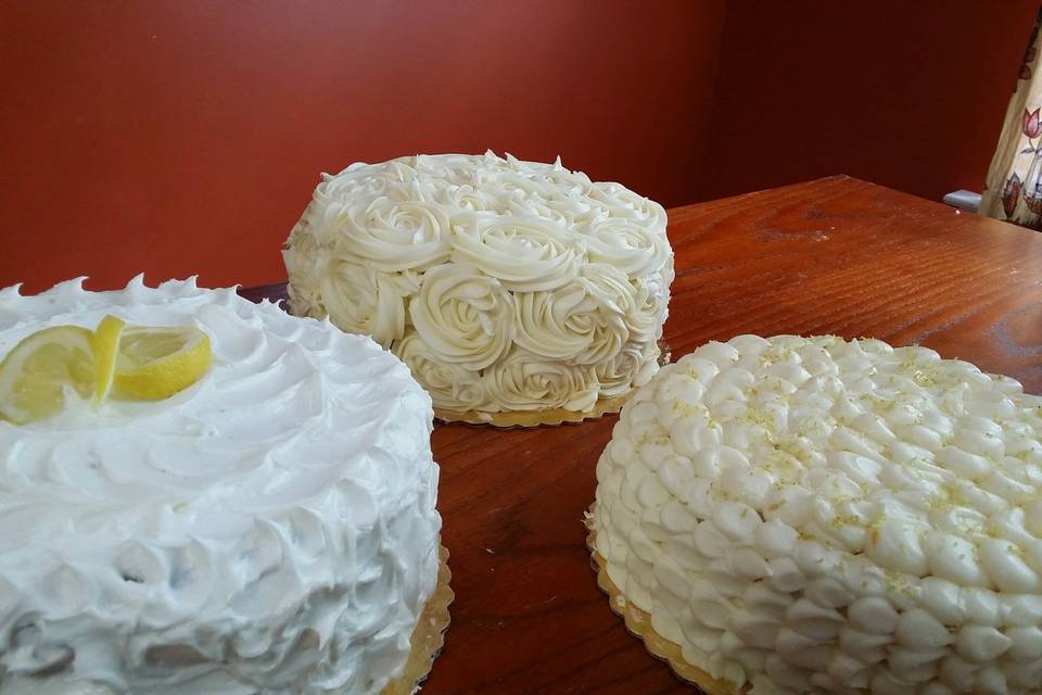 Triple lemon wonder: lemon cake with butter cream, lemon cake with cheesecake, lemon sour cream cake