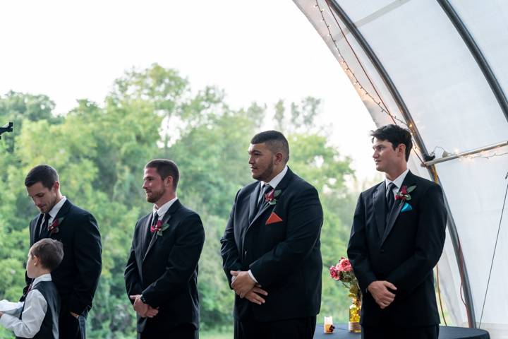 The groomsmen barely hanging