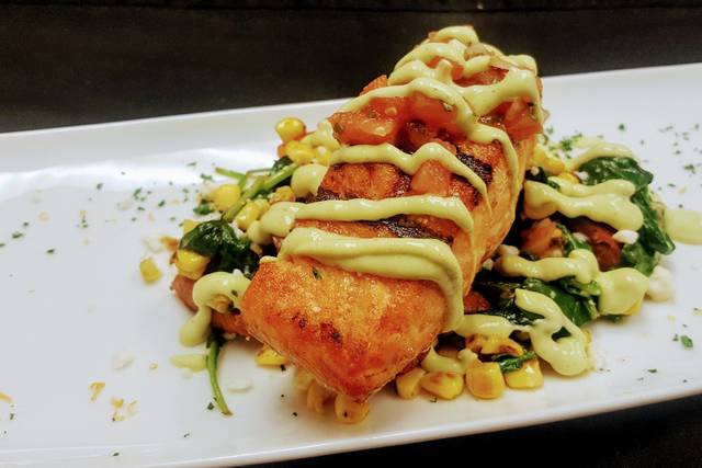 Grilled Fundy Salmon/ grilled corn succotash/ avocado crema