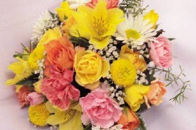 Bridesmaid bouquet in yellow, pink, & white blooms.