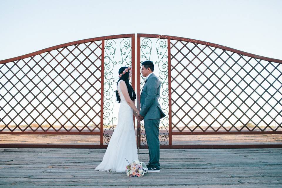 Bride and groom holding hands