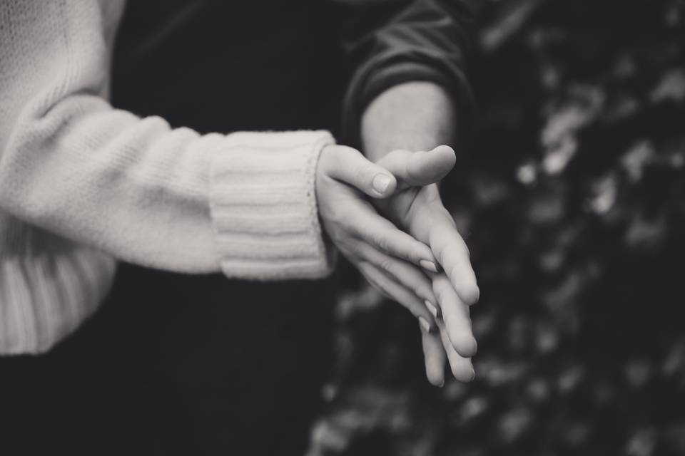 Couple touching hands