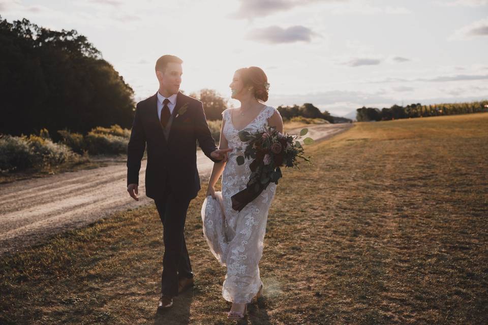 Happy couple walking in field
