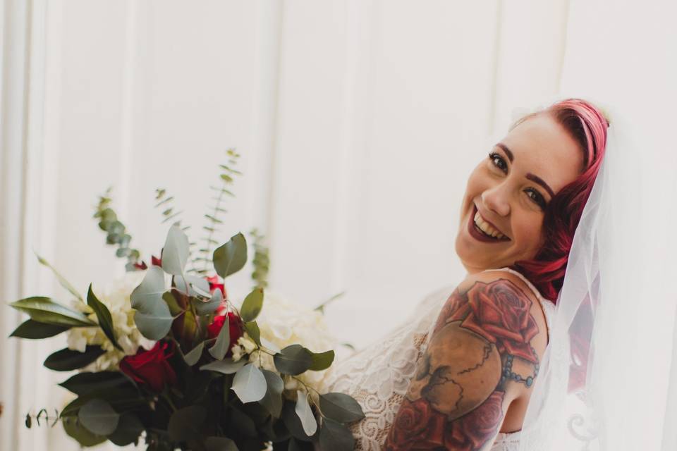 Happy bride with bouquet