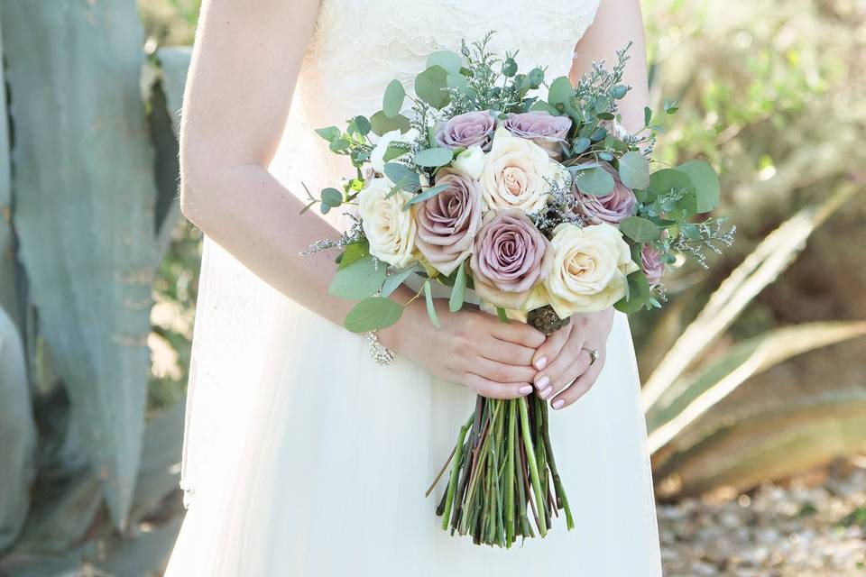 A happy bride with elegant bouquet