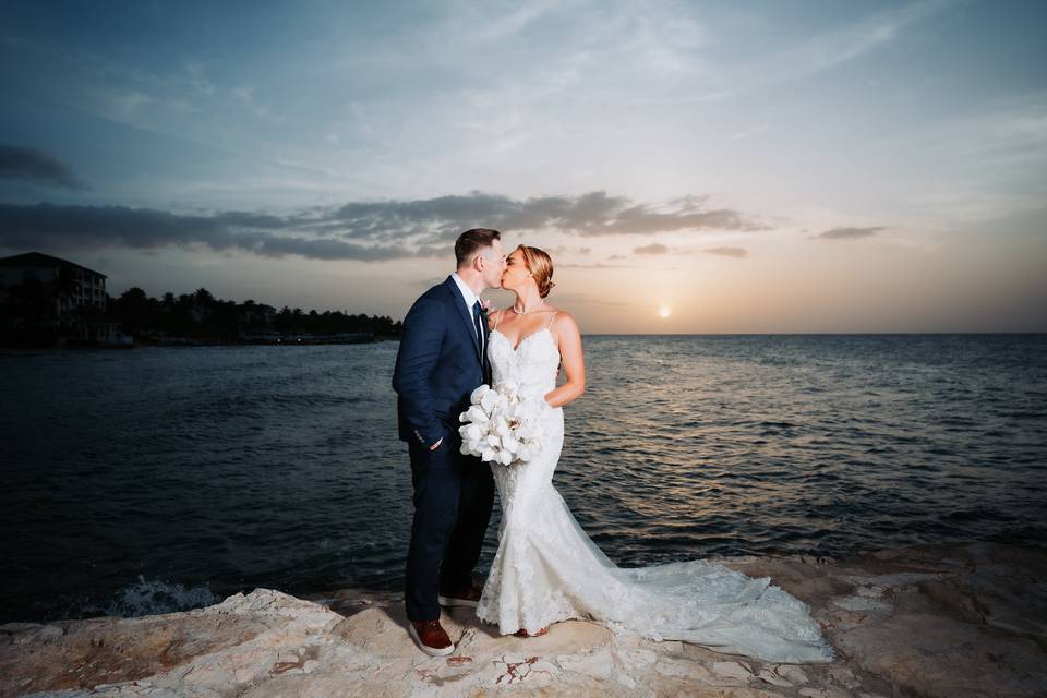 Bride & Groom Kiss at Sunset