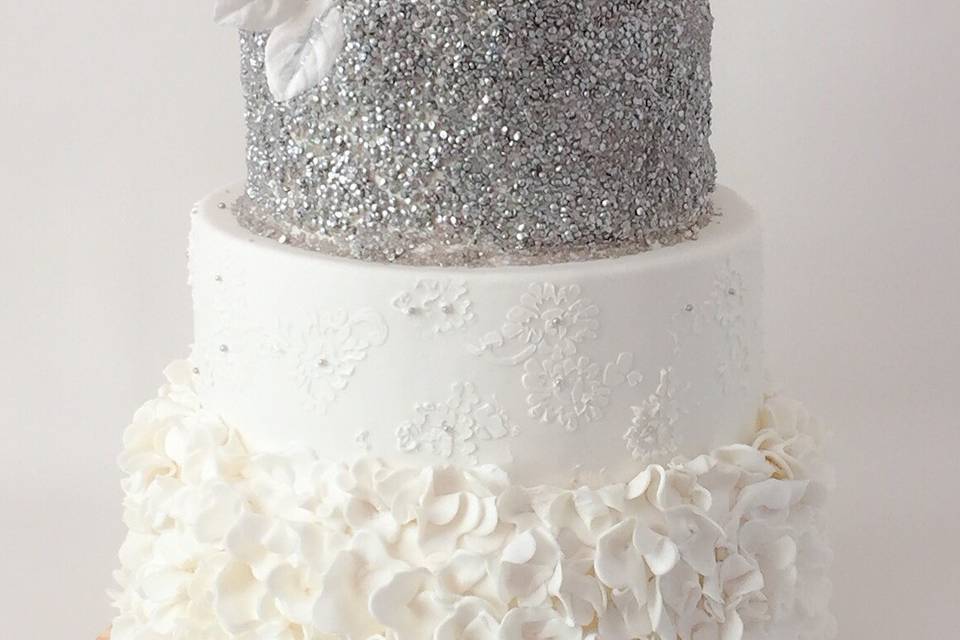 Ruffled four tired cake with edible sequins