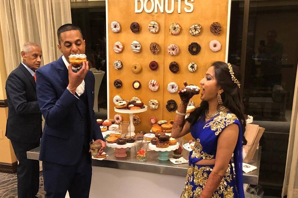 Happy couple enjoying some donuts