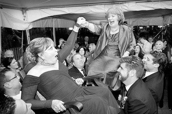 The Mothers are lifted during the Hora at a jewish wedding at the Biltmore Estate.