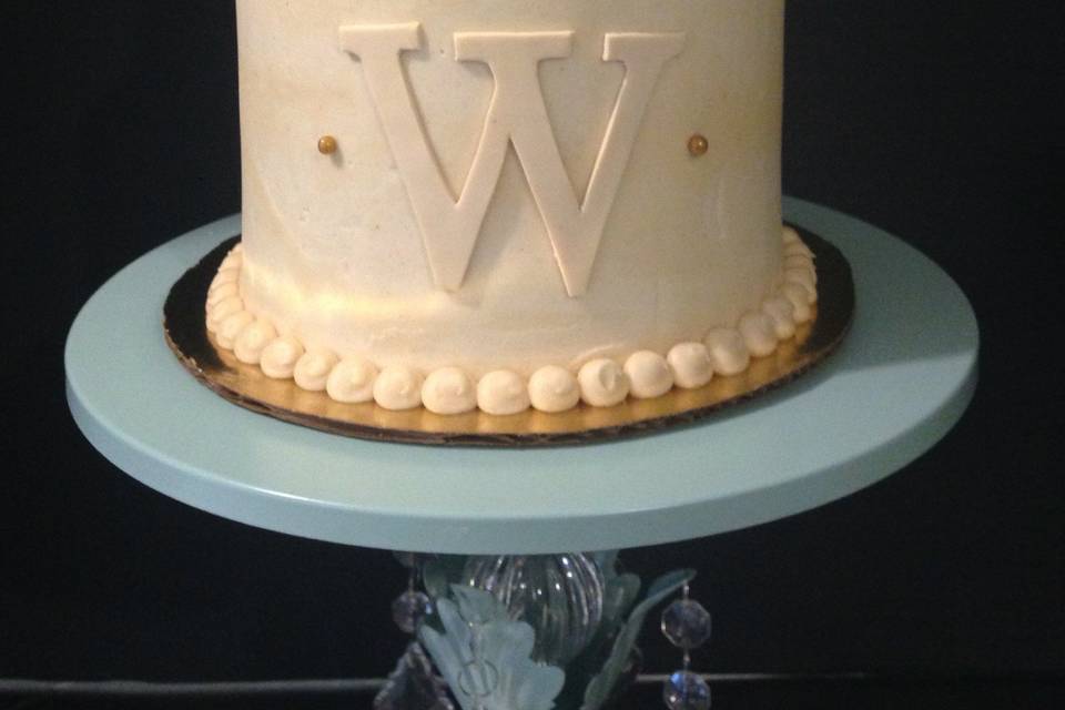 2-tier cake with intricate details and initial