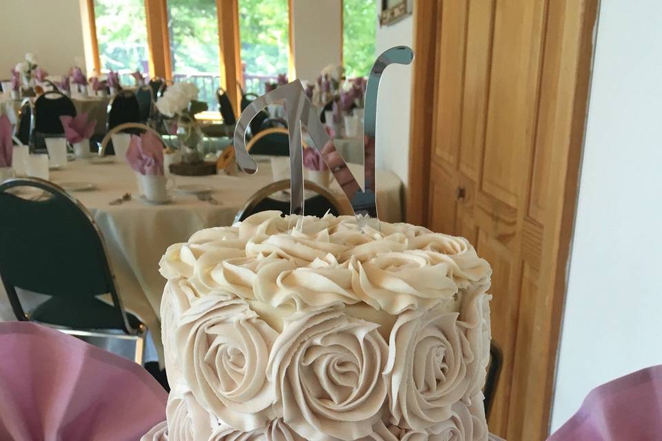 White and purple cake with floral icing