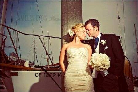 Couple posing by a boat