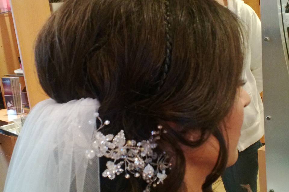 Beautiful bride with side chignon crystal comb