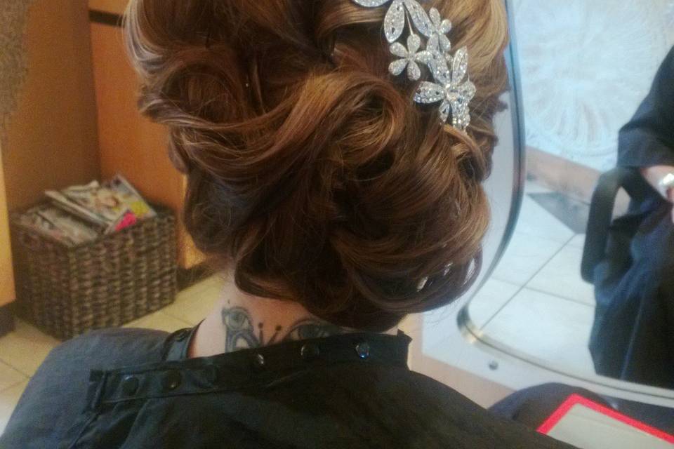 Beautiful side chignon with flower comb accent