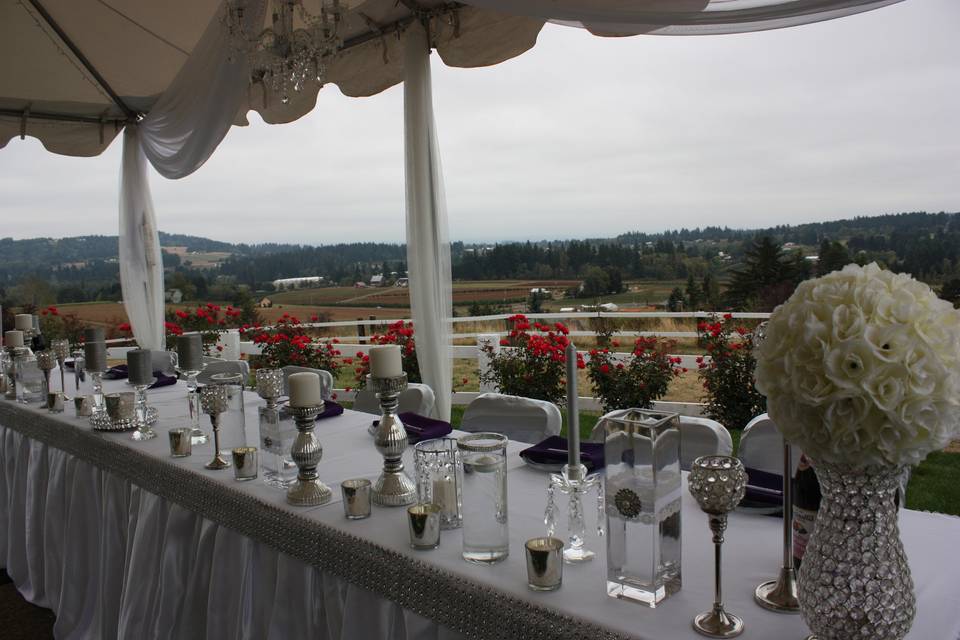 Table setup with candle and flower centerpiece