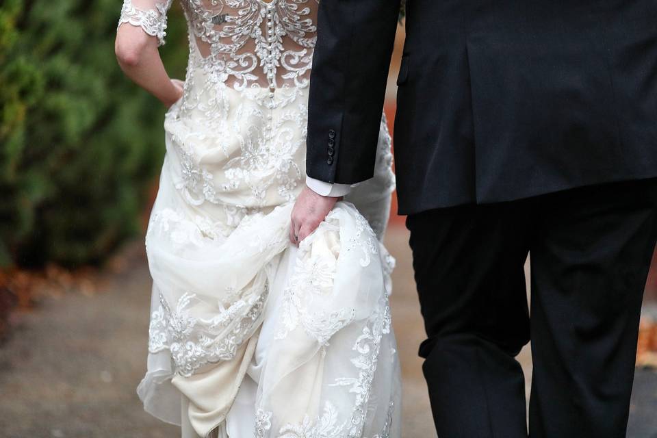 Groom helping Bride