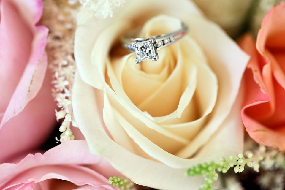 Wedding ring on rose
