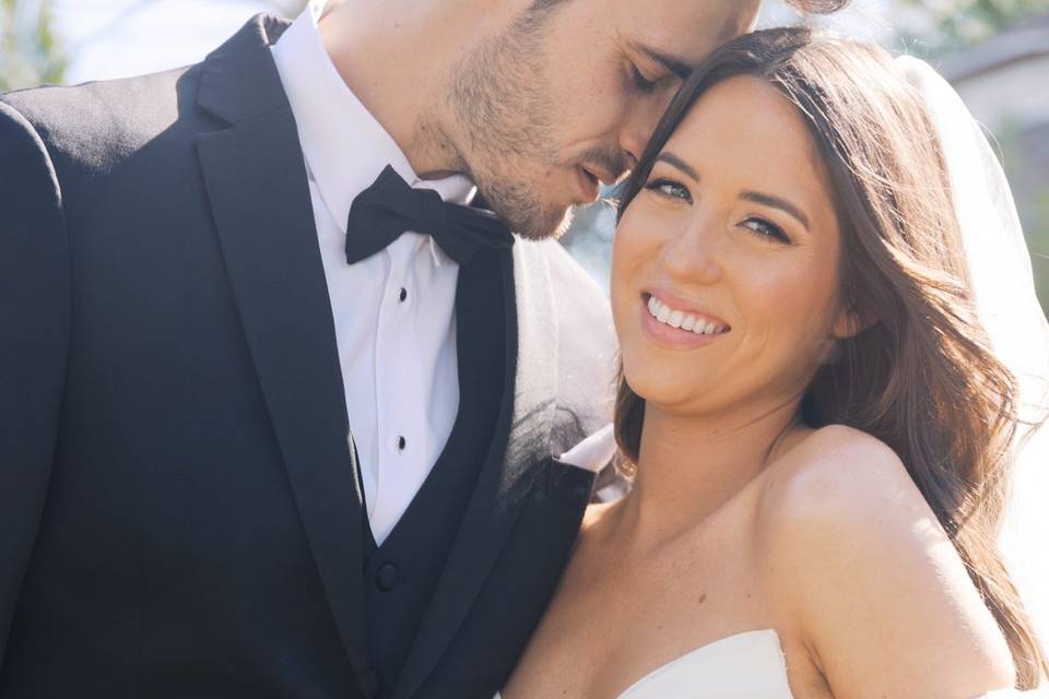 Bride and groom smiling close