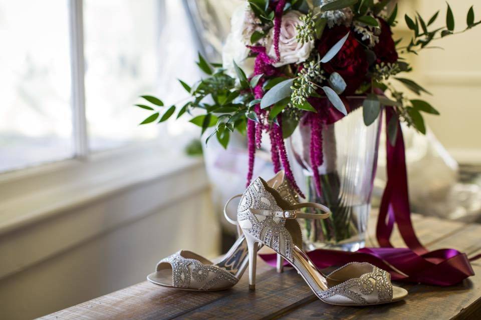 Bridal bouquet with blushes, ivories and burgundy accents.