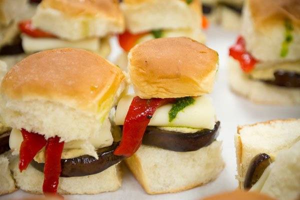 Grilled eggplant and hummus sliders with roasted peppers and basil pesto